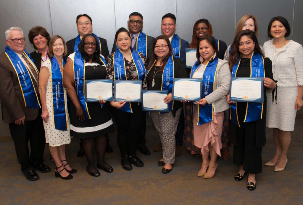 Nurse Scholars Academy graduates with diplomas
