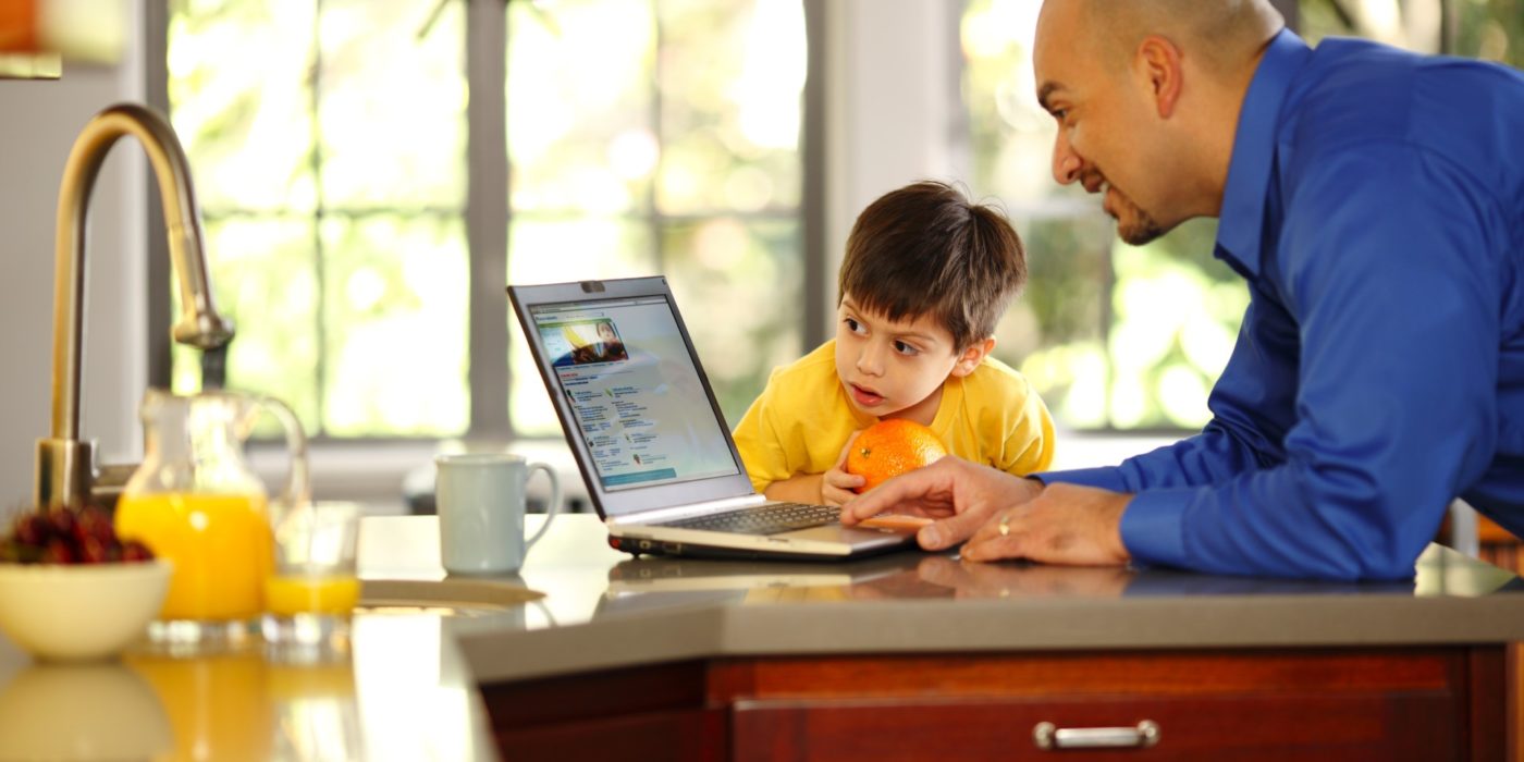 Dad And Child In Front Of Laptop
