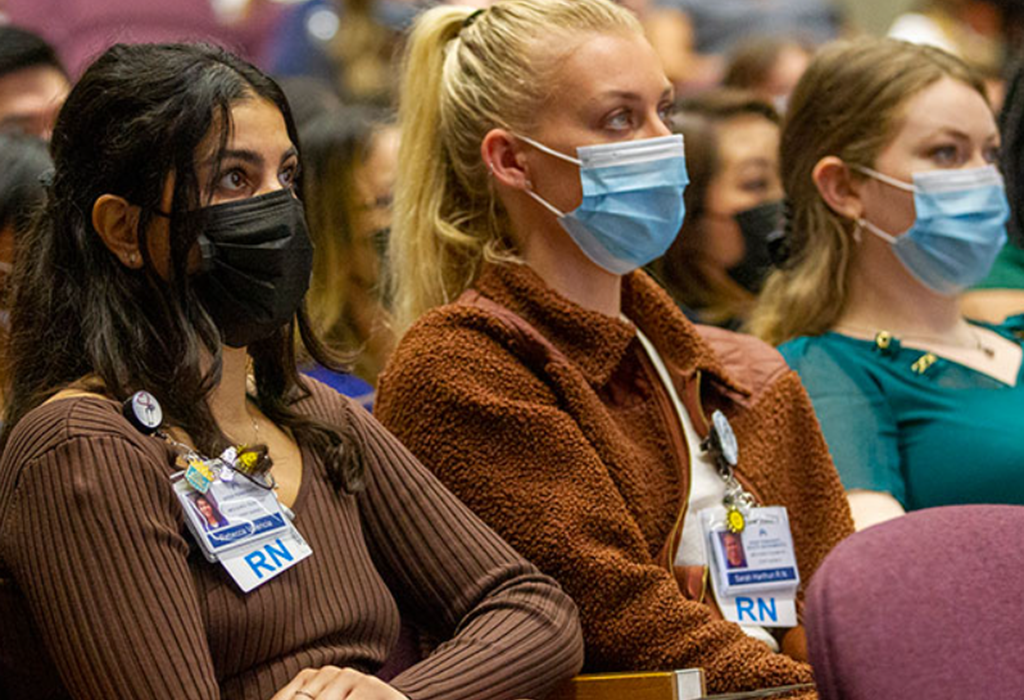 Rebecca Valencia, RN, At Left, Listens With Other Graduates To A Presentation During The Nurse Residency Graduation In May.